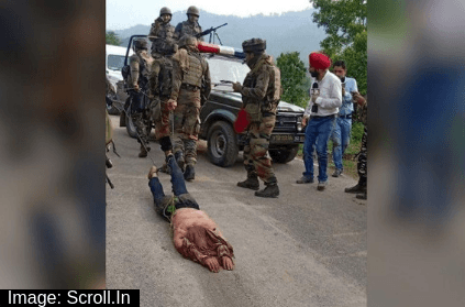 security forces drag militant\'s dead body using ropes