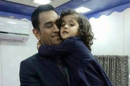 Watch Dhoni play around with little girl on vanity bus