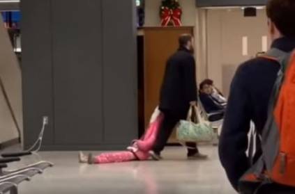 Watch - Father frustrated with daughter drags her at airport